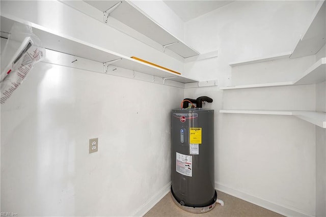 utility room featuring electric water heater