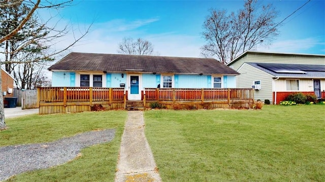 single story home with a porch and a front lawn