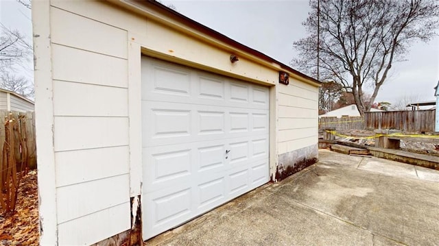 garage with fence