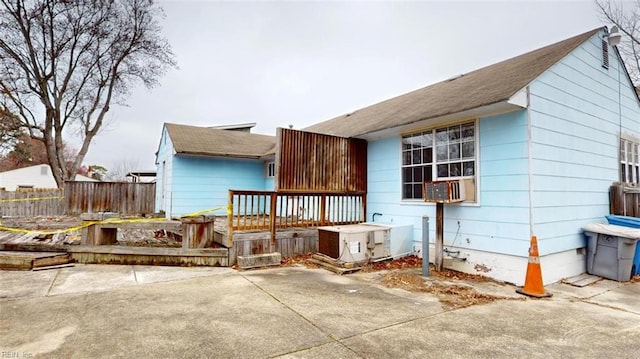 view of property exterior with crawl space and fence