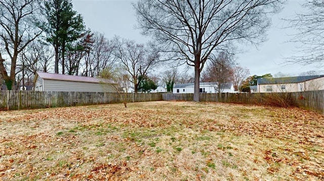 view of yard with a fenced backyard