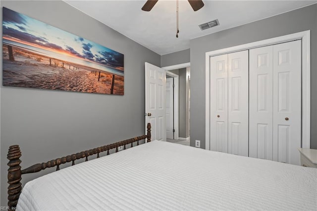 bedroom with visible vents, a closet, and ceiling fan