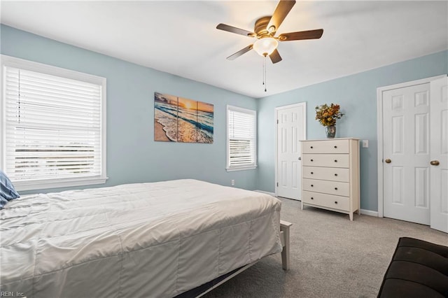 bedroom with baseboards, carpet, and a ceiling fan