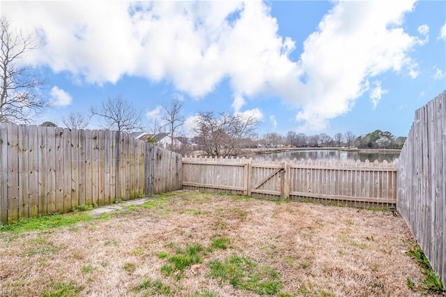 view of yard with a fenced backyard