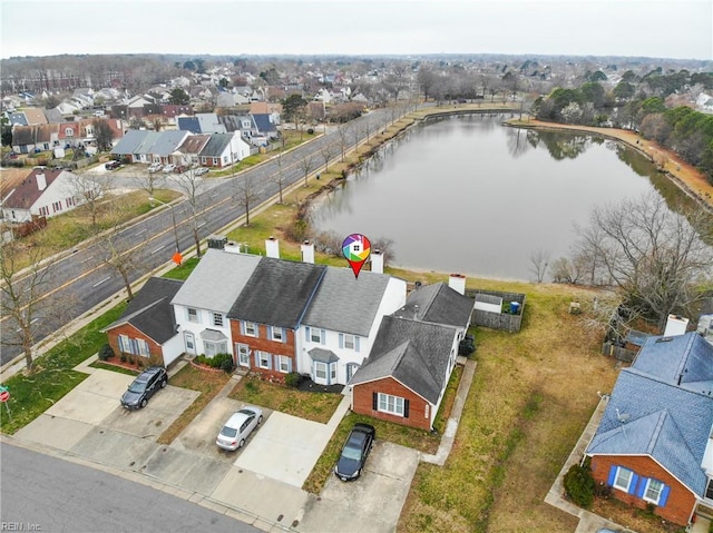 drone / aerial view with a residential view and a water view