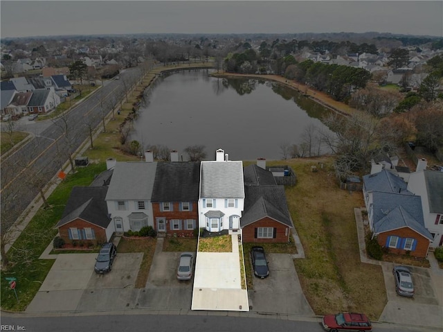 aerial view with a residential view and a water view