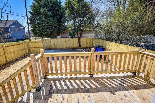 deck with a fenced backyard