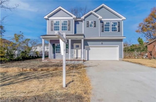 view of front of home with a garage and concrete driveway