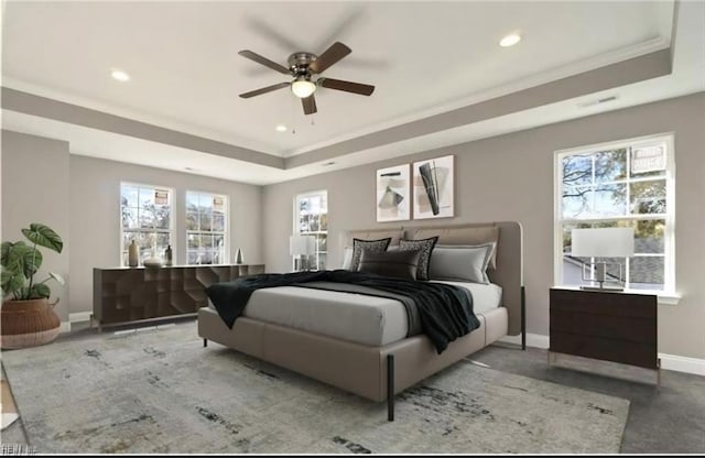 bedroom featuring recessed lighting, a raised ceiling, baseboards, and ornamental molding