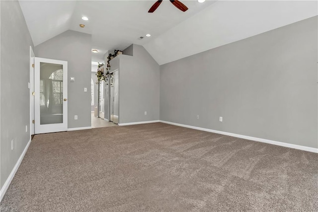 interior space with recessed lighting, baseboards, lofted ceiling, and a ceiling fan