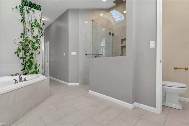 bathroom with tile patterned flooring, a walk in shower, toilet, a skylight, and a bath