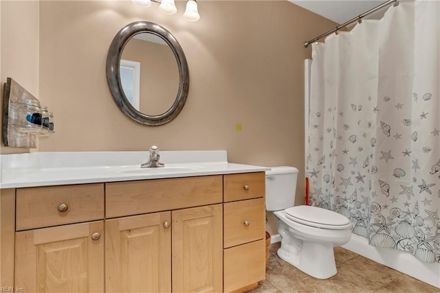 full bath with tile patterned floors, shower / bath combo with shower curtain, toilet, and vanity