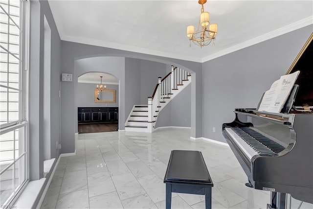 foyer entrance featuring arched walkways, a notable chandelier, marble finish floor, and stairs