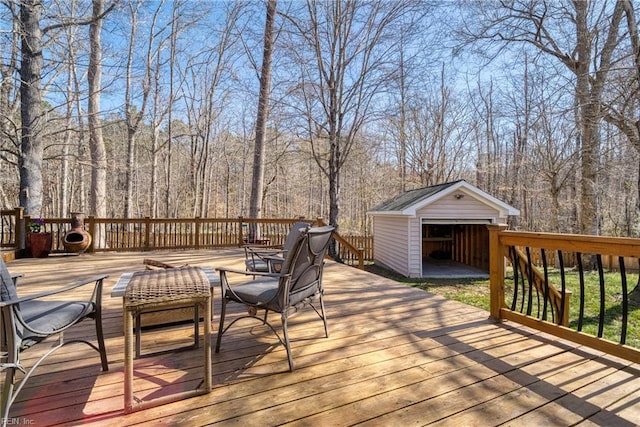 deck with a view of trees and an outdoor structure