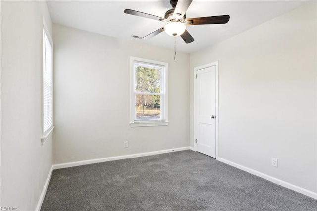 spare room with visible vents, baseboards, carpet, and ceiling fan