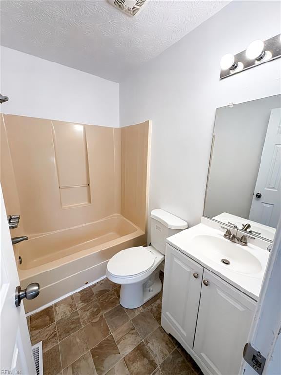 full bathroom with vanity, visible vents, shower / washtub combination, a textured ceiling, and toilet