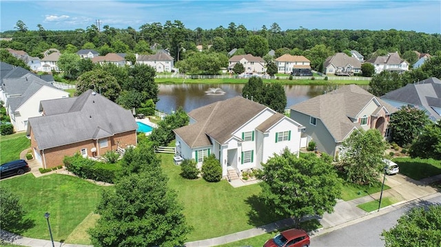 drone / aerial view with a residential view and a water view