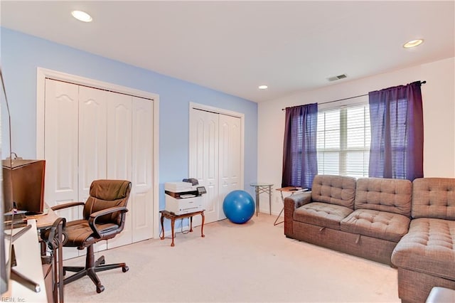 interior space featuring visible vents, recessed lighting, and carpet flooring