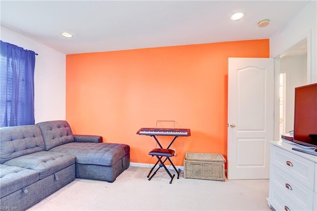 living area featuring recessed lighting, light colored carpet, and baseboards