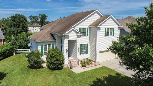 traditional home with a front lawn, fence, concrete driveway, an attached garage, and a shingled roof