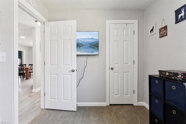 carpeted bedroom with baseboards