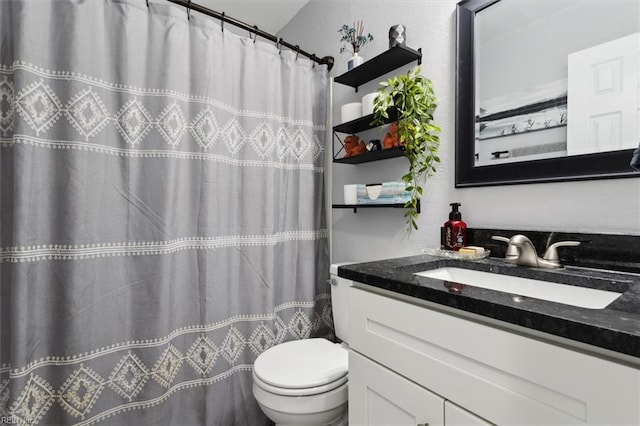 bathroom featuring vanity, curtained shower, and toilet