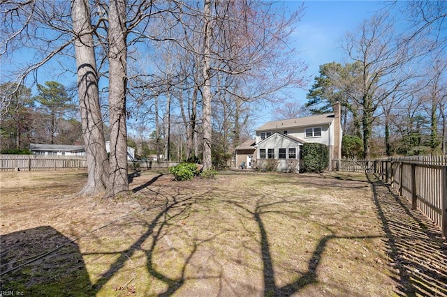 view of yard with a fenced backyard