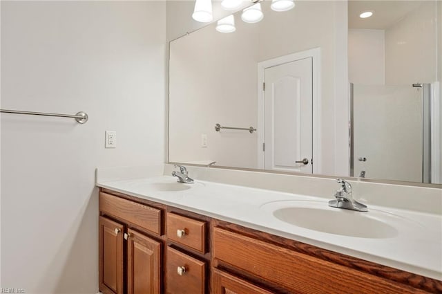 bathroom featuring a sink and double vanity