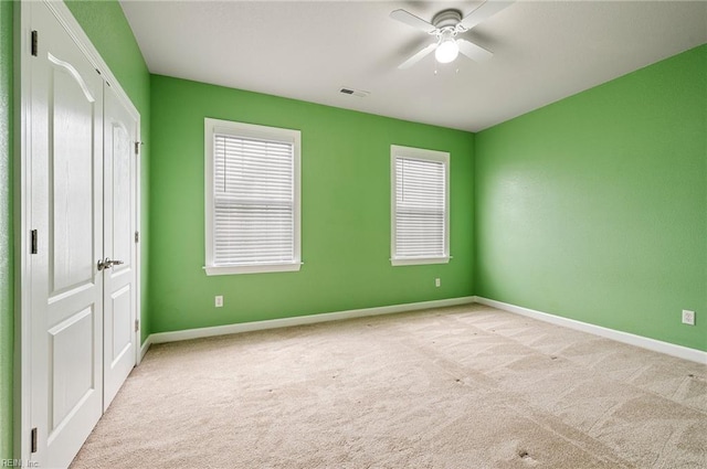 unfurnished bedroom featuring a closet, visible vents, baseboards, and carpet