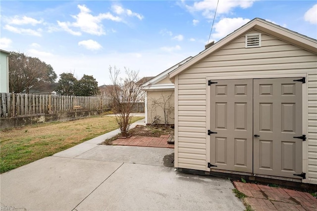 view of shed with fence