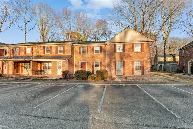 view of building exterior featuring uncovered parking