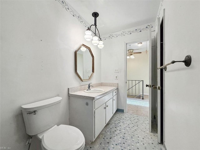 bathroom with toilet and vanity