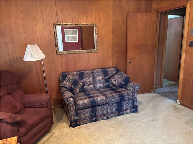 living room with wooden walls and carpet