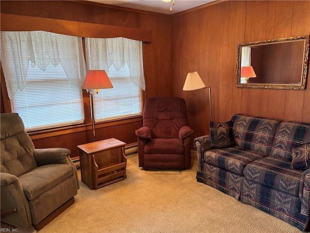 living area with carpet floors, baseboard heating, ceiling fan, and wooden walls