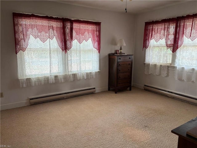 carpeted spare room with a baseboard heating unit, baseboards, and a baseboard radiator