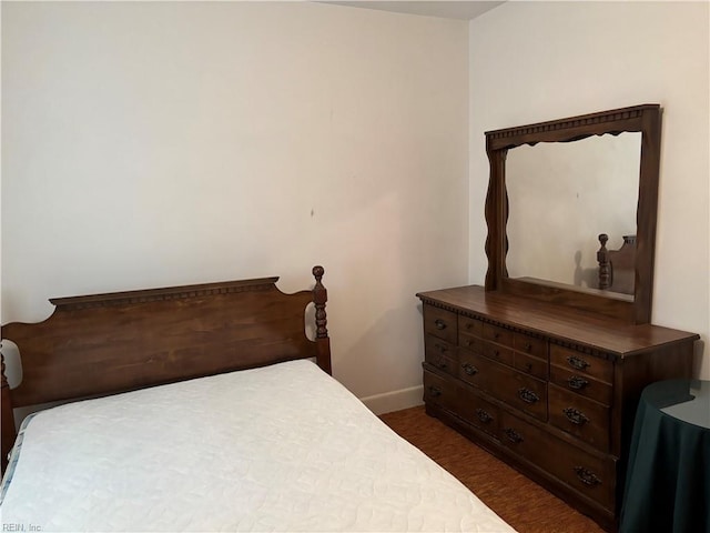 bedroom featuring baseboards