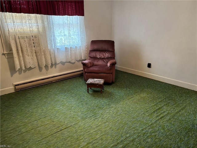 living area featuring carpet flooring, baseboards, and a baseboard radiator