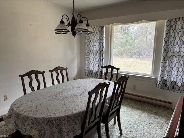 dining room featuring a baseboard radiator and a notable chandelier