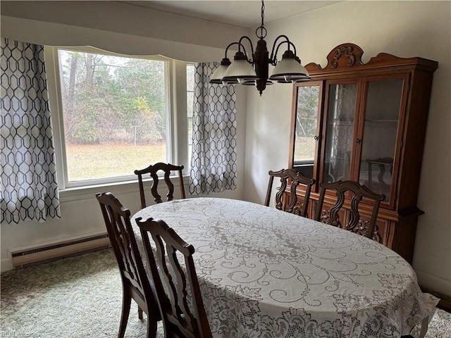 dining area with a notable chandelier and a baseboard radiator