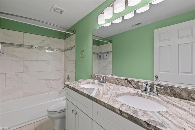 bathroom featuring a sink, visible vents, and toilet