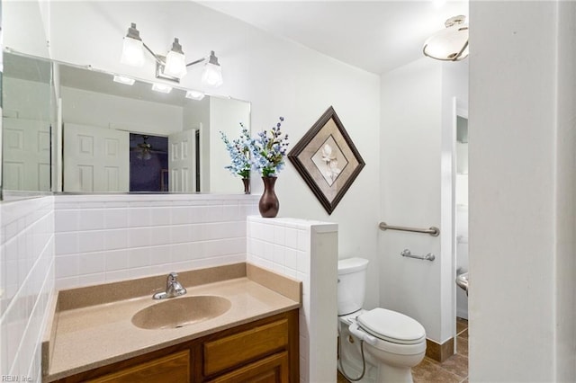 bathroom featuring tile patterned floors, tasteful backsplash, toilet, and vanity