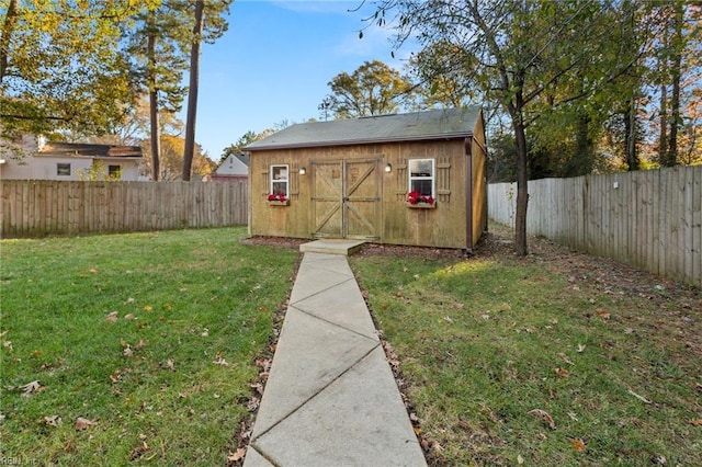 view of shed featuring a fenced backyard