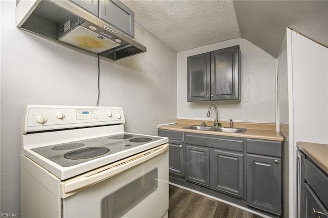 kitchen with white range with electric cooktop, gray cabinets, a sink, under cabinet range hood, and a textured ceiling