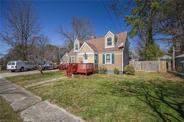 cape cod house with a deck, a front lawn, fence, and crawl space