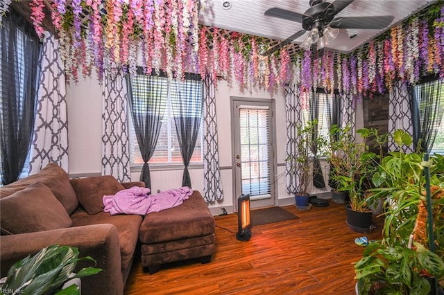 sitting room featuring a ceiling fan and wood finished floors