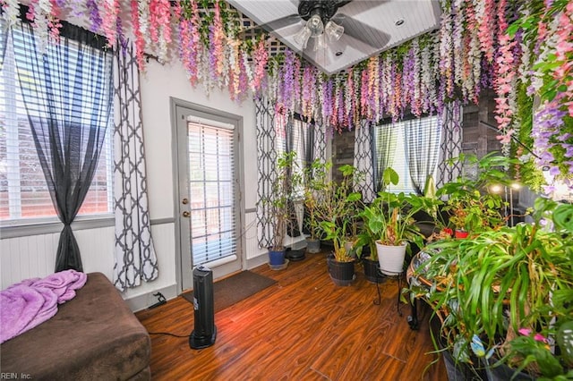 sitting room with a healthy amount of sunlight, wood finished floors, and a ceiling fan