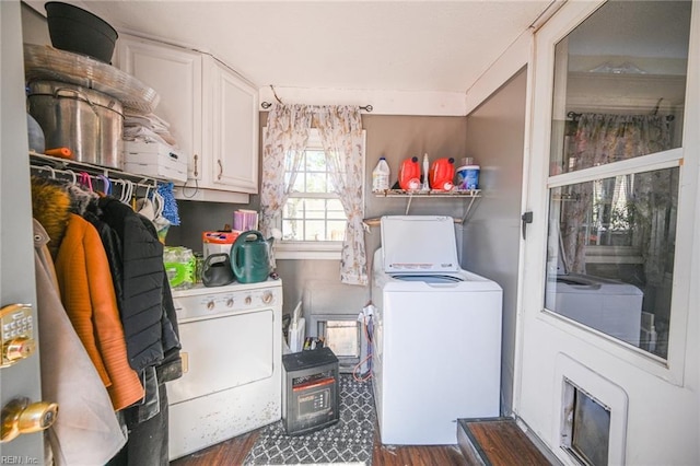 laundry area with washer and dryer, laundry area, and dark wood-style flooring