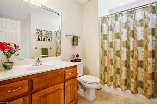 bathroom with tile patterned floors, toilet, and vanity