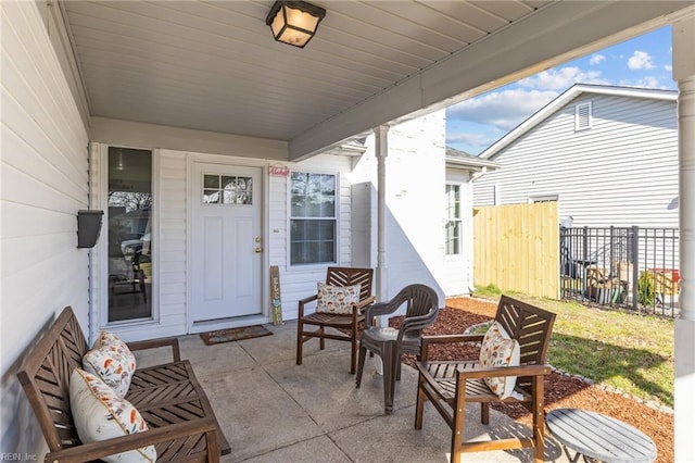 view of patio / terrace featuring fence