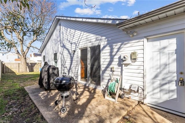 back of property with a patio and fence